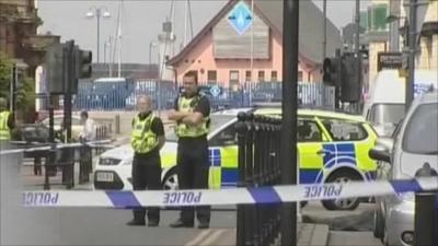 Police officers at June's crime scene in Cumbria