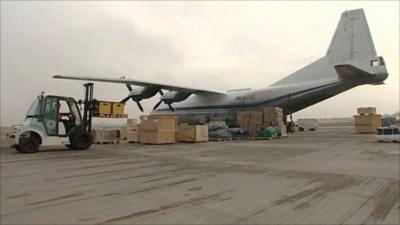 A supply plane being loaded with aid