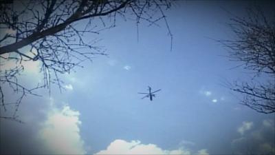 Pictures reportedly showing a helicopter attacking Libyan opposition