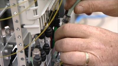 An engineer setting up a broadband exchange