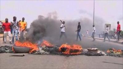 Pro Ouattara supporters burning tyres