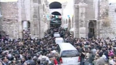 President Bashar al-Assad's car being mobbed by supporters