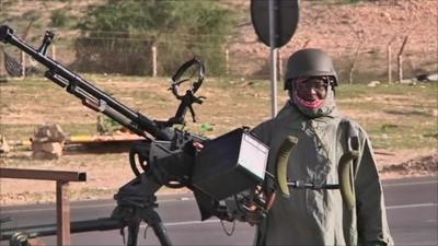 Man with large machine gun