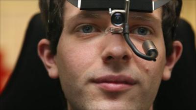 A man wearing an eye-tracking camera