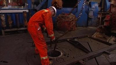 Man drills for oil