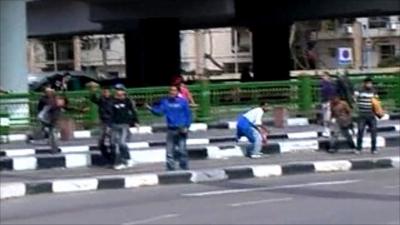 People throwing stones in Cairo