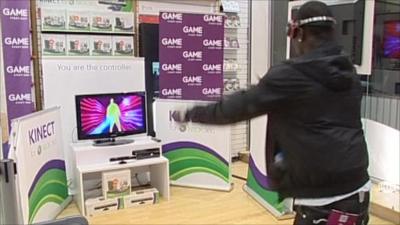 Man plays game with Kinect