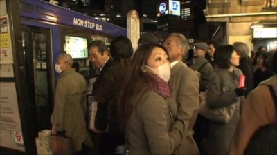 People stand in Tokyo street