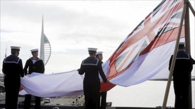 HMS Ark Royal's flag being lowered for the last time