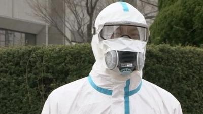 A man in protective clothing