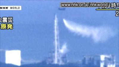 Helicopter drops water on nuclear reactor