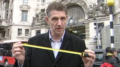BBC reporter Nick Lawrence with tape measure