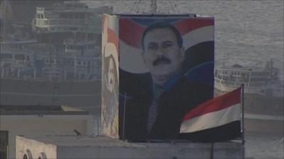 Building with picture of Ali Abdullah Saleh painted on side