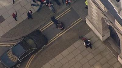 Protester lies in front of George Osborne's car