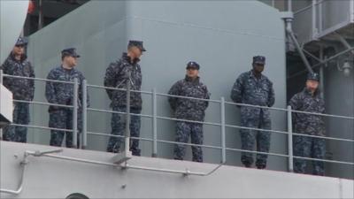 Crew aboard USS Bataan