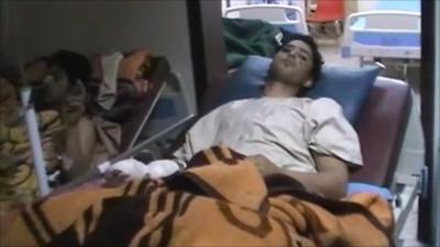 Injured man in a hospital bed