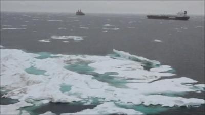 Icebergs and boats in the sea