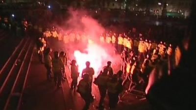 Police and protesters clash in Trafalgar Square