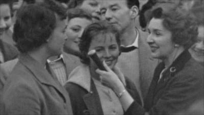 Jean Metcalfe talks to people outside Clarence House