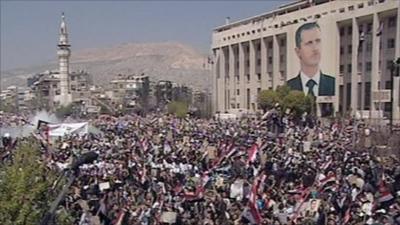 Thousands gather for a pro-Assad rally