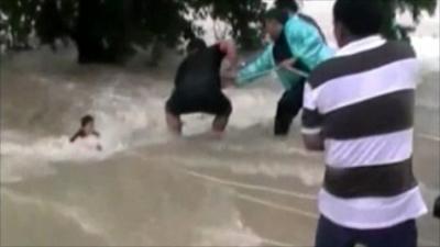 Man pulled from flood water in Thailand