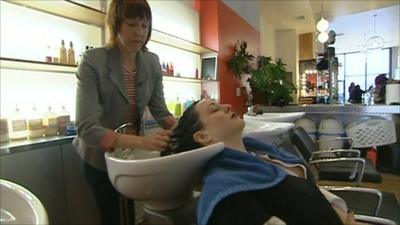 Woman having her hair washed