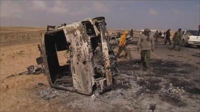 Burned out vehicles ten miles outside Ajdabiya