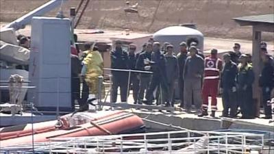 Italian rescuers with survivors