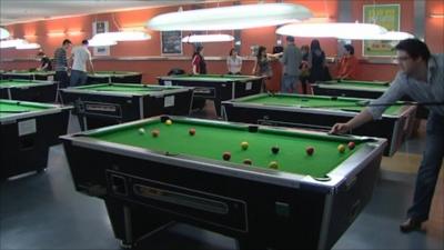 Students playing pool