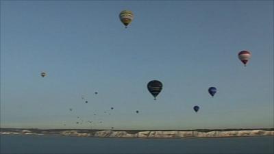 The balloons travel over the white cliffs of Dover