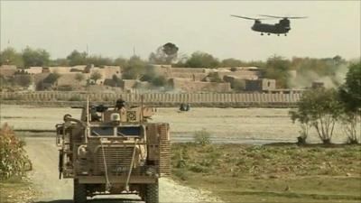 UK armed forces vehicle and helicopter