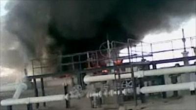 Screen grab from amateur footage that appears to show an oil field on fire