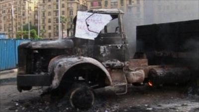 A burnt out lorry in Tahrir Square