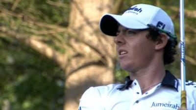 Rory McIlroy watches an iron shot