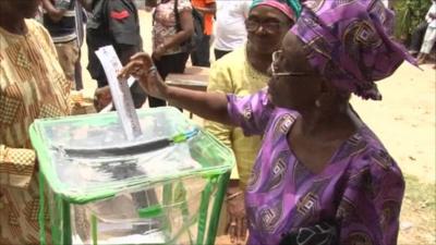 Woman casts vote in Nigeria