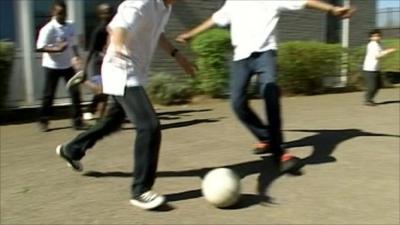 Visually impaired children playing football