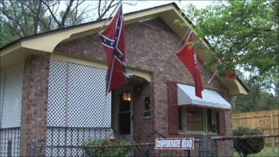 Confederate flag hangs from house