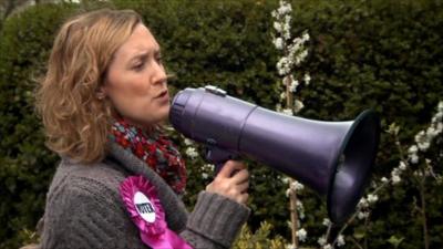 A woman with a loud speaker