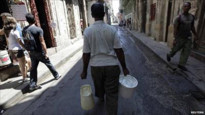 Man with buckets of water