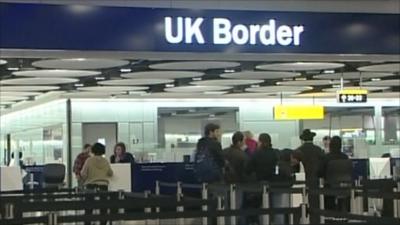 UK border control with people queuing