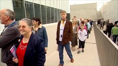 People queue to see the gallery