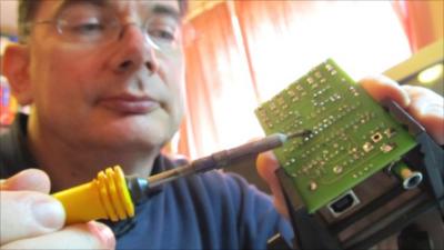 John Honniball solders an 8-bit microprocessor circuit board