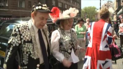 A Pearly king and queen at a street party in New York