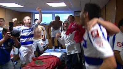 QPR players celebrate winning promotion from the Championship to the Premier League