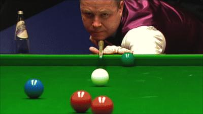 World Championship finalist John Higgins plays one of the shots of the tournament
