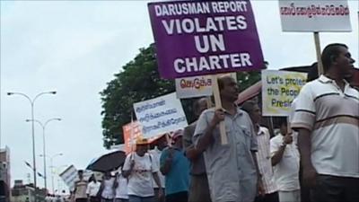 Protesters in Sri Lanka carrying anti-UN placards