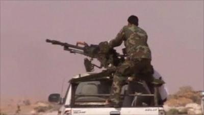 An armed rebel fighting in Libya