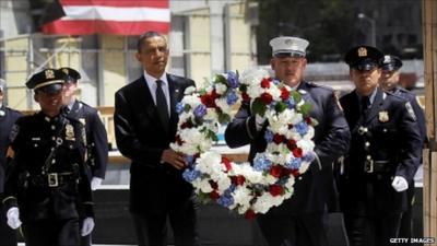 President Obama and a policeman with wreath