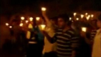 Syrians taking part in candlelight rally