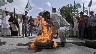 A man burning a tyre